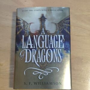 A Language of Dragons Hardcover Book